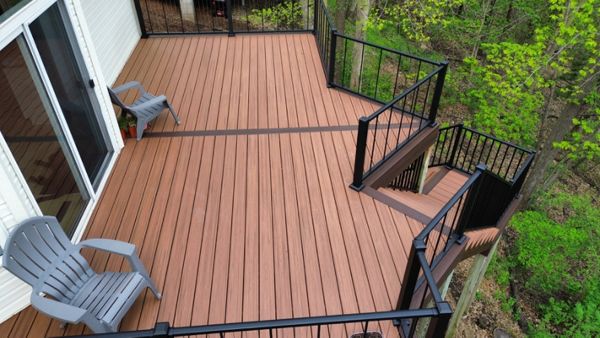 Trex Transcend Composite Decking, Tiki Torch primary with Lava Rock Boarders and Black Aluminum Railing in Prior Lake, MN