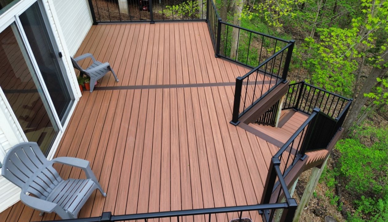 Trex Transcend Composite Decking, Tiki Torch primary with Lava Rock Boarders and Black Aluminum Railing in Prior Lake, MN