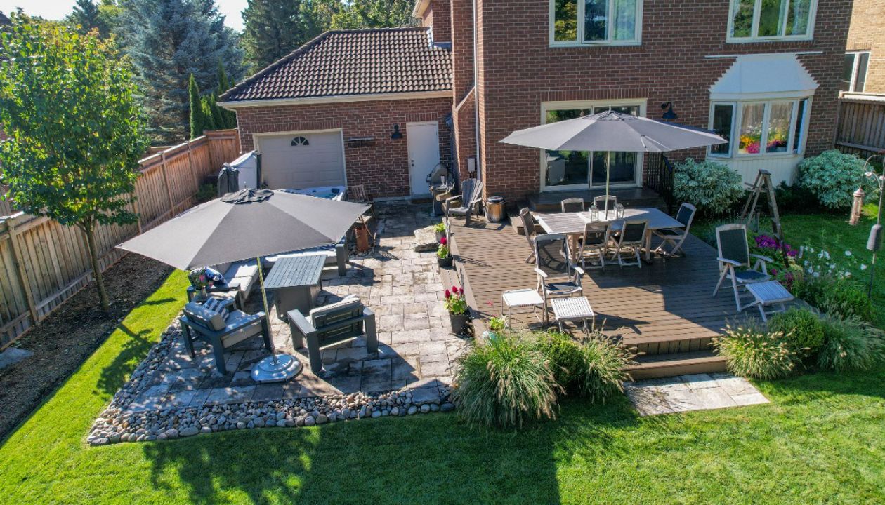 A Trex deck with a stone patio is our favourite combo!