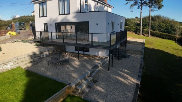 Signature rail with glass worked beautifully on this balcony deck