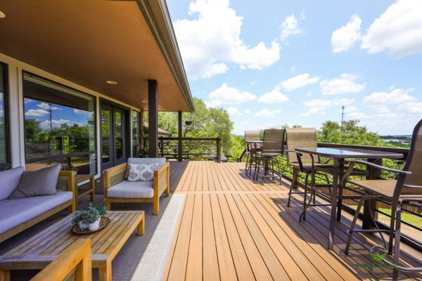 Covered Trex deck with a contrasting picture-frame border and outdoor lounge seating