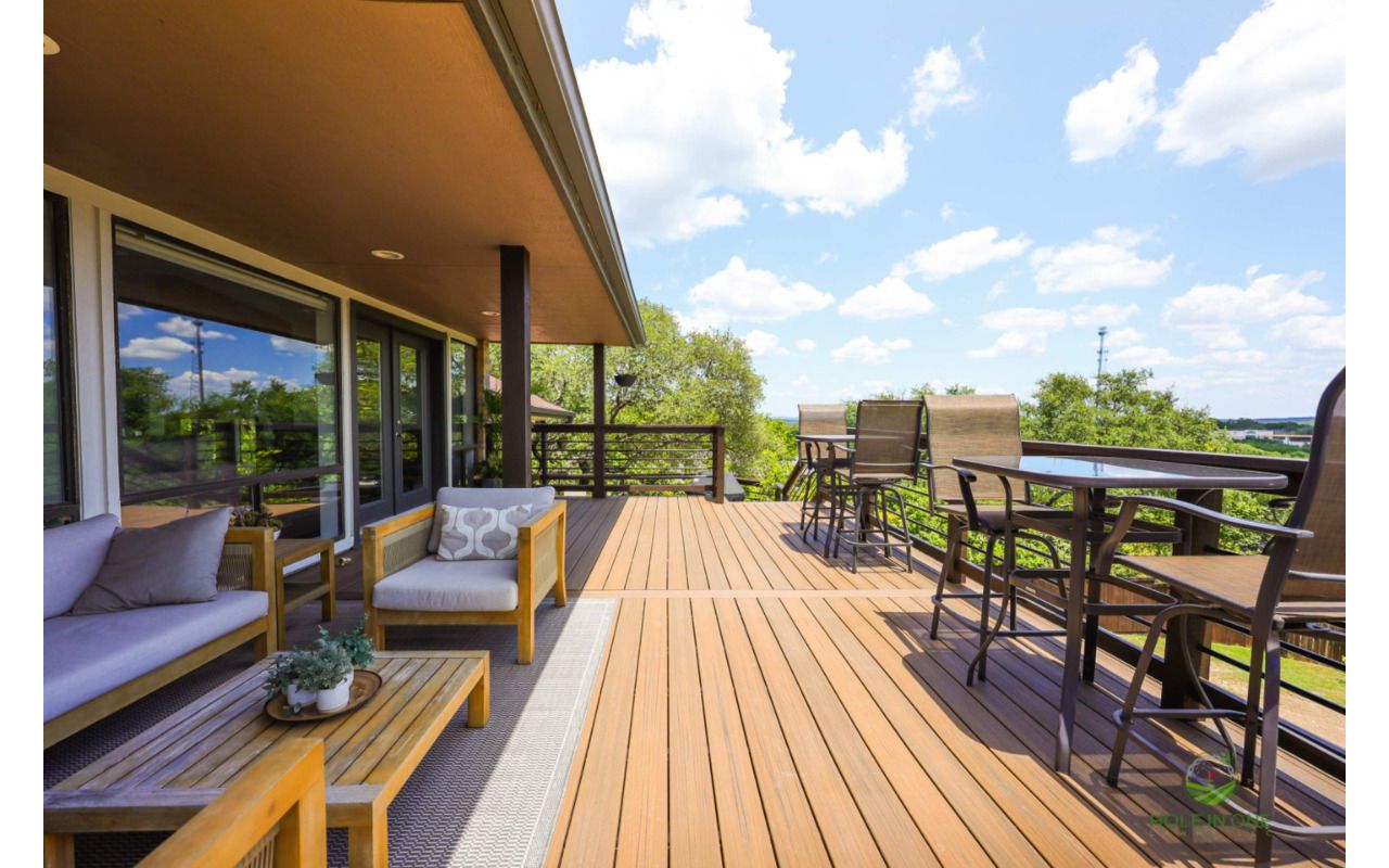 Covered Trex deck with a contrasting picture-frame border and outdoor lounge seating