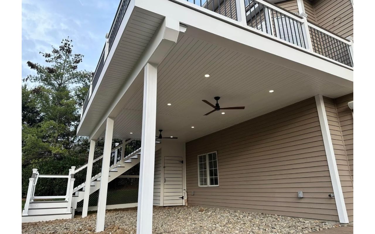 Elevated Trex composite deck with under-deck ceiling system. Adds usable covered space below while maintaining a clean, modern structure.