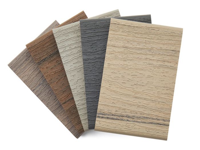 A set of six rectangular composite material samples featuring wood-like textures. The samples are displayed fanned out, showcasing a range of neutral tones including beige, gray, and brown. The textures mimic natural wood grain patterns, ideal for construction or design projects.