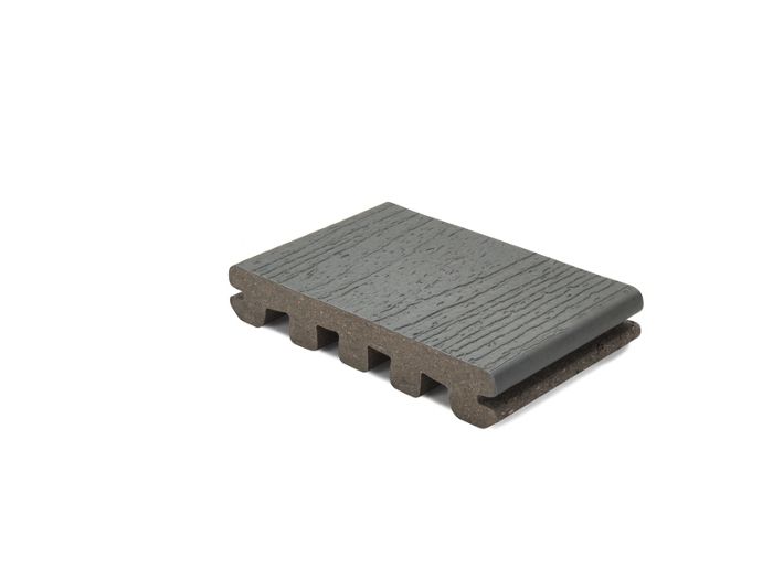 A single piece of gray composite decking board is displayed against a white background. The board features a wood grain texture on the surface and a grooved underside for installation. The sample is shown in a clean, isolated studio setting, highlighting its material and construction details. No visible text, numbers, or branding are present in the image.