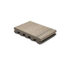 A single piece of composite decking board is displayed against a plain white background. The board features a wood grain texture on the top surface and a grooved underside, suggesting durability and slip resistance. The neutral brownish-grey color and clean lines highlight its suitability for modern outdoor spaces. No visible text, numbers, or logos are present.