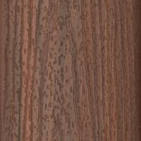 This image features a detailed close-up of a brown wood surface, showcasing its natural grain and texture. The wood displays a mix of dark and light brown tones with visible linear patterns and organic markings. The setting is neutral, focusing solely on the material's surface without any additional objects or text. The overall mood is earthy and rustic, highlighting the beauty of natural materials.