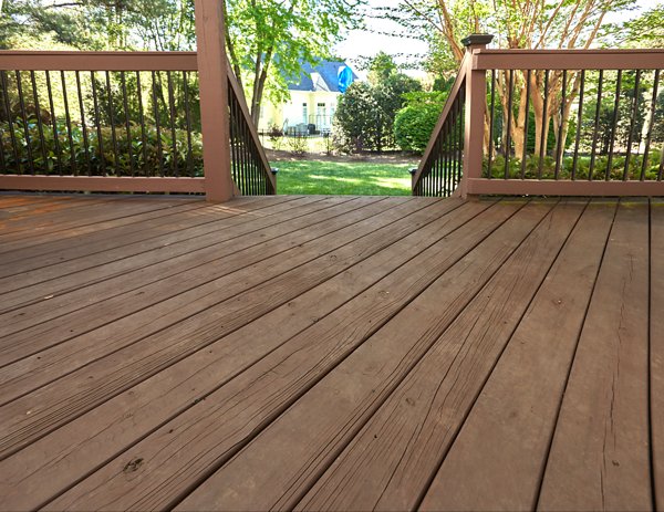 A wooden deck with splinters and old wood showing its degradation after some time.