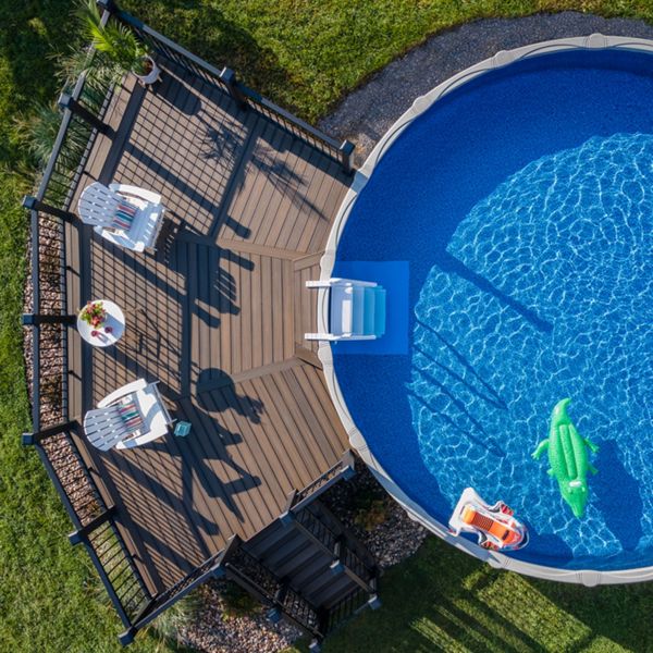 A Trex deck in a dark brown color accenting an above ground pool.