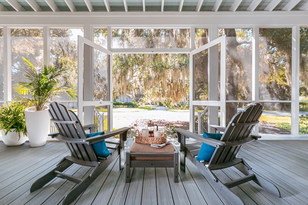 Trex adirondack chairs in a screened-in porch facing spanish moss