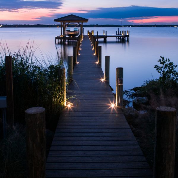 7. Dock at night made with Trex Transcend with Trex outdoor lighting lighting the night beautifully.