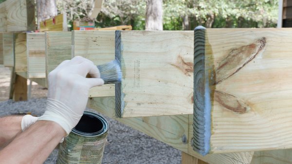 treating all cut joist ends to protect against water damage