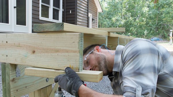 attaching rim joist supports to fasten field joists