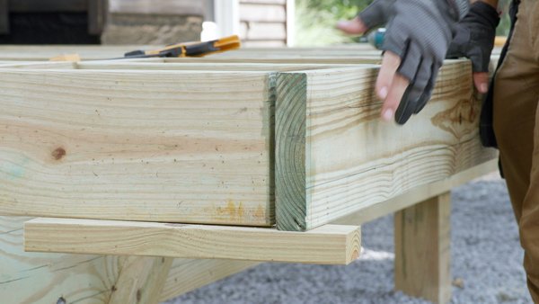 placing rim joist on top of the supports