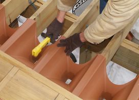How to Install the Downspouts for the Trex® RainEscape® Under-Deck Drainage System