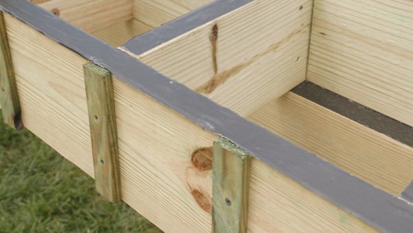 Flashing tape on the frame of a deck being built.