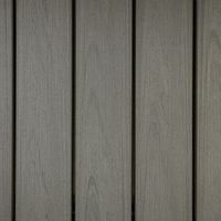 The image shows a close-up view of several gray wooden planks arranged vertically. The surface displays a subtle wood grain pattern, giving a natural and slightly rustic appearance. The color palette is neutral, dominated by shades of gray, and the lighting is even, highlighting the texture of the wood. No visible text, numbers, or logos are present in the image.