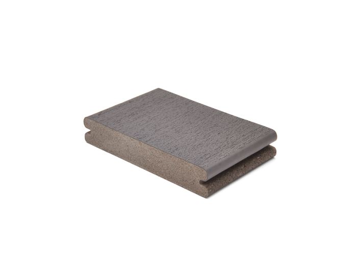 A single gray composite decking board is displayed against a plain white background. The board features a textured surface and grooved edges, suggesting it is designed for easy installation in outdoor decking projects. The neutral gray color and clean lines highlight its modern, functional style. No visible text, numbers, or branding are present on the board.