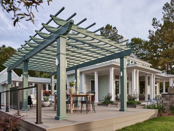 HGTV Dream Home 2025 photo of the Trex Biscayne accented by the Trex Pergola and Trex Signature X-Series Railing to bring together the modern lowcountry look. 