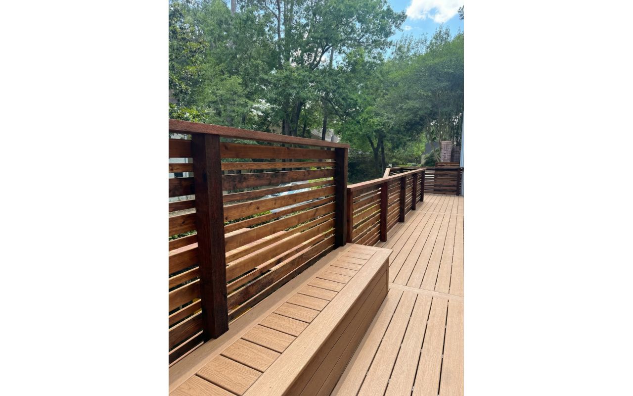 Modern composite deck with cedar privacy screen and built-in bench. A functional and private outdoor space designed for comfort and long-term performance in Houston weather.