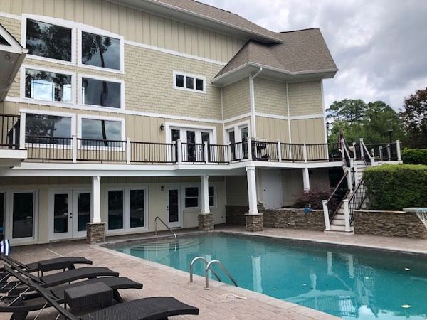 Breath-taking new Trex Enhance Toasted Sand deck with Transcend Vintage Lantern railing in Cary, NC
