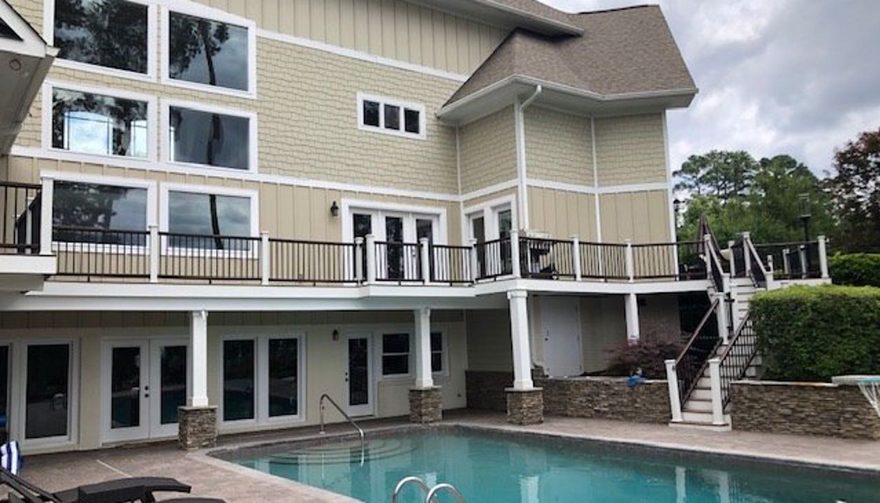 Breath-taking new Trex Enhance Toasted Sand deck with Transcend Vintage Lantern railing in Cary, NC
