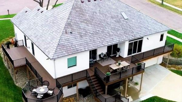 Transcends Spiced Rum Decking & Fascia With Signature Black Metal Railing