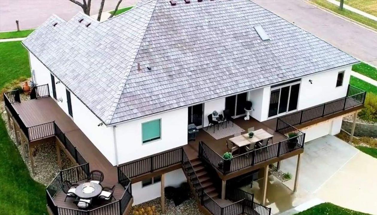 Transcends Spiced Rum Decking & Fascia With Signature Black Metal Railing