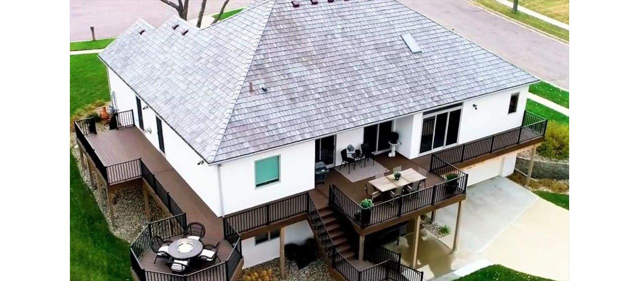 Transcends Spiced Rum Decking & Fascia With Signature Black Metal Railing