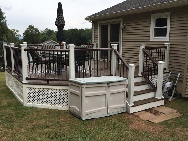 Trex Transcend project in Middletown, CT.  Spiced Rum field featuring a Vintage Lantern border.  - Railings are Trex Transend in Vintage Lantern with black aluminum balusters.