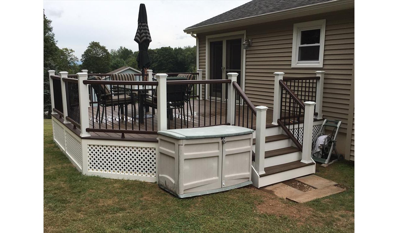 Trex Transcend project in Middletown, CT.  Spiced Rum field featuring a Vintage Lantern border.  - Railings are Trex Transend in Vintage Lantern with black aluminum balusters.