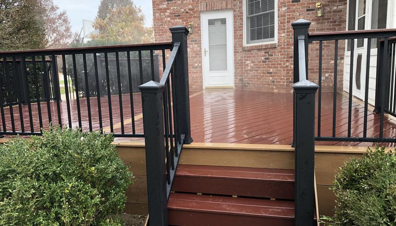 Trex Select Maderia w/ Beach Dune border. Trex Signature aluminum railing with cocktail board