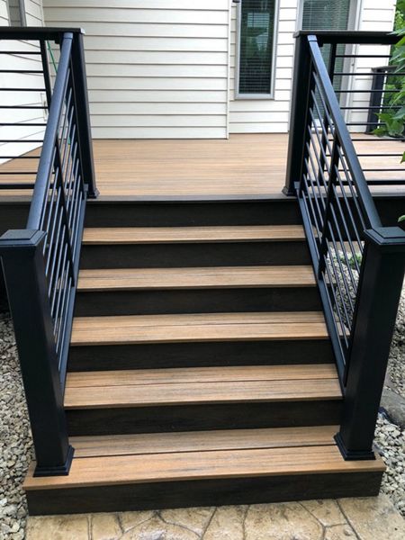 Trex/Transcend/Composite Decking and Trex/Transcend/Spiced Rum Fascia and Border with Trex/Signature/Rod-Rail (all black) and Trex/Transcend/Spiced Rum Composite Decking Cocktail Rail