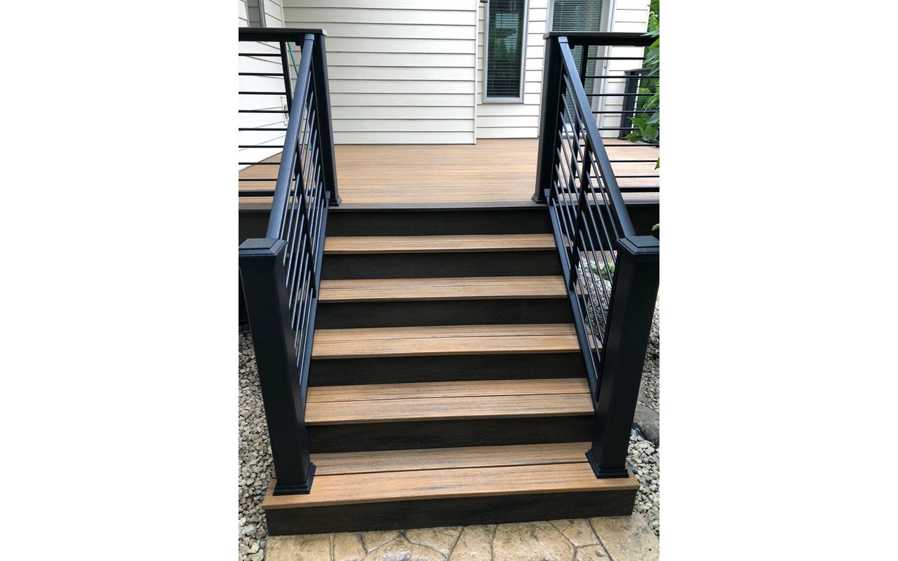 Trex/Transcend/Composite Decking and Trex/Transcend/Spiced Rum Fascia and Border with Trex/Signature/Rod-Rail (all black) and Trex/Transcend/Spiced Rum Composite Decking Cocktail Rail