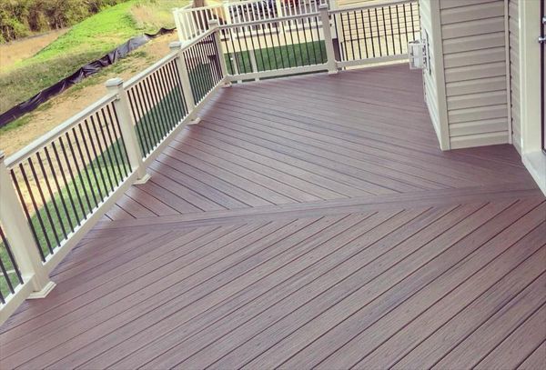 Trex Transcend Tiki Torch Decking and White Transcend Railing