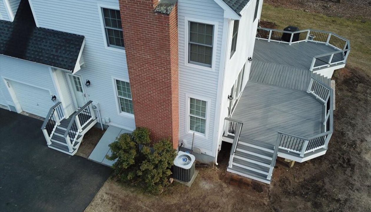 Trex Island mist decking with wedge lights on each post sleeve