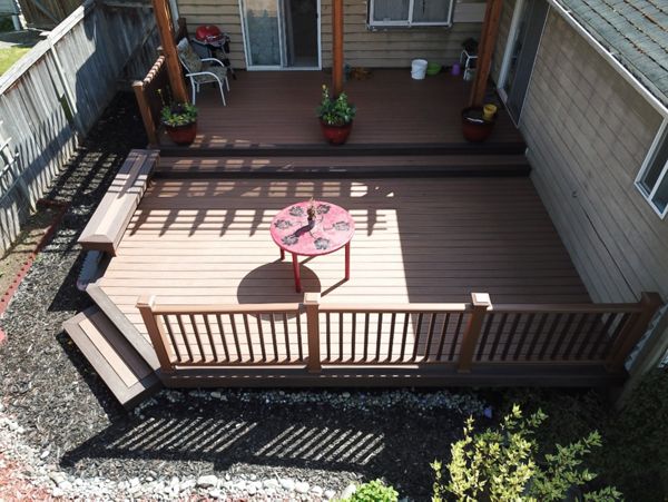 Edmonds, WA Trex Deck featuring Tiki Torch decking with Tree House Railing and Vintage Lantern balusters.