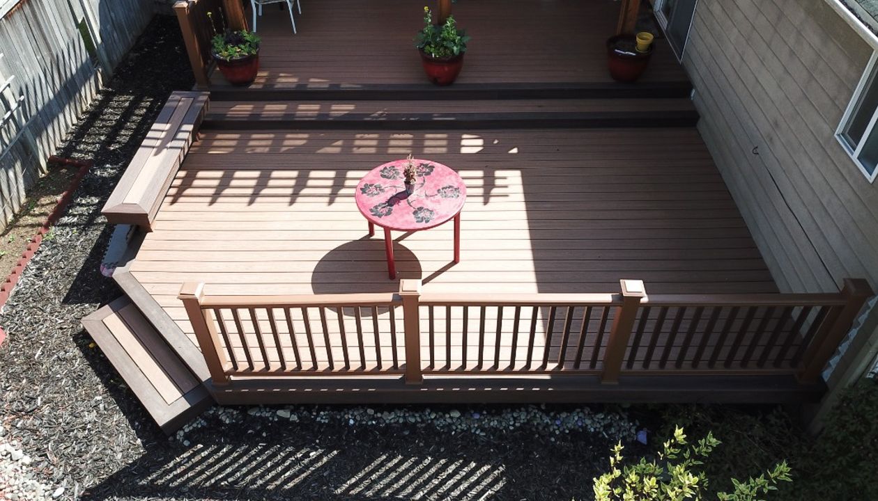 Edmonds, WA Trex Deck featuring Tiki Torch decking with Tree House Railing and Vintage Lantern balusters.