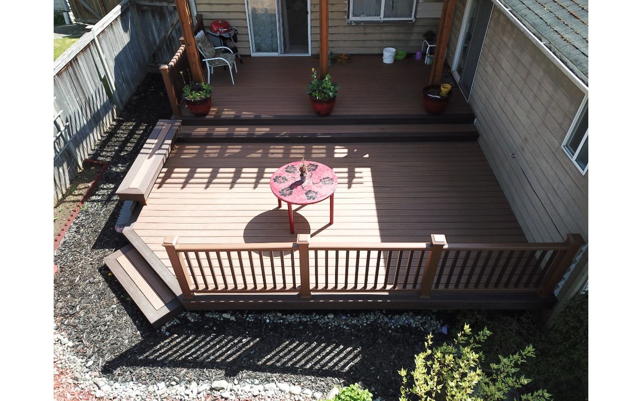 Edmonds, WA Trex Deck featuring Tiki Torch decking with Tree House Railing and Vintage Lantern balusters.