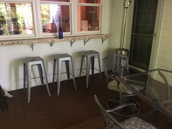 Imagine relaxing on a lazy Saturday with friends at this great bar area on your new Trex porch project!