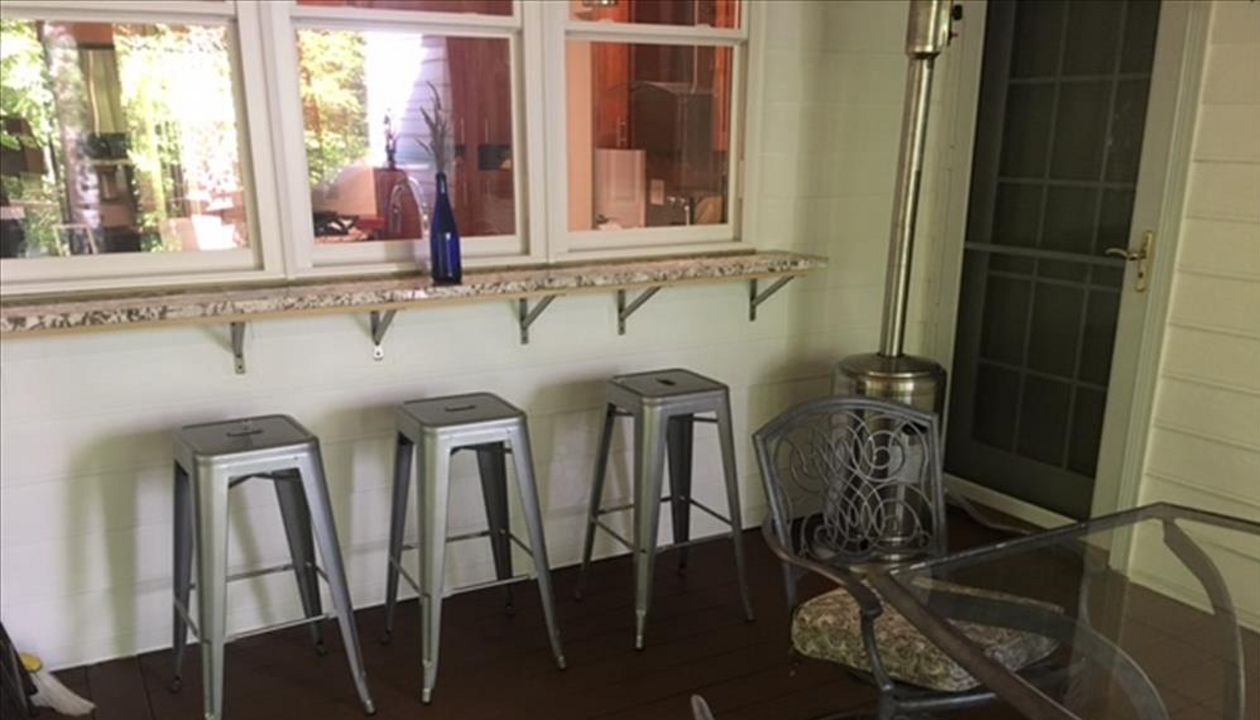 Imagine relaxing on a lazy Saturday with friends at this great bar area on your new Trex porch project!