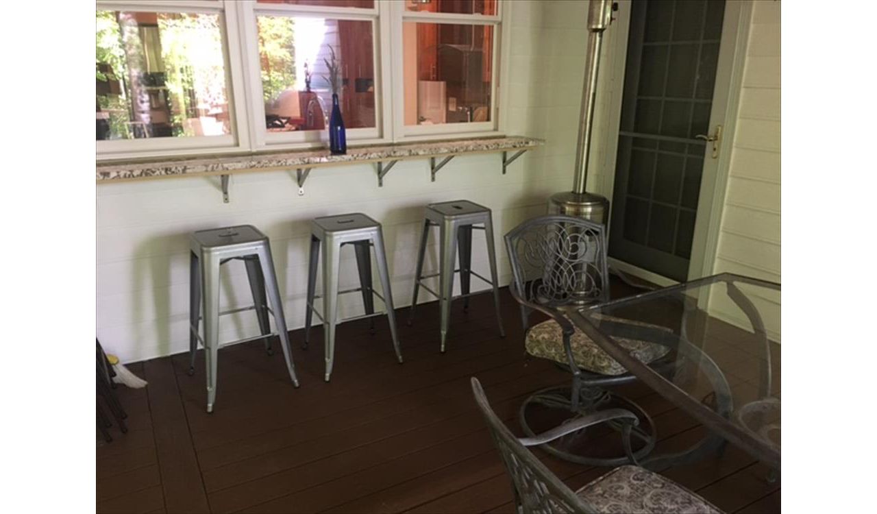 Imagine relaxing on a lazy Saturday with friends at this great bar area on your new Trex porch project!