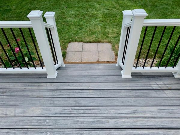 Trex Transcend railing with aluminum balusters.  West Michigan custom deck builder.