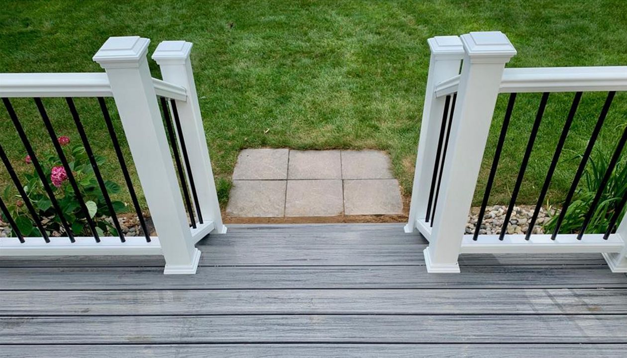 Trex Transcend railing with aluminum balusters.  West Michigan custom deck builder.