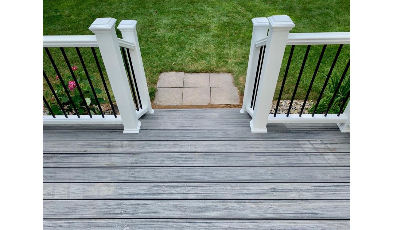 Trex Transcend railing with aluminum balusters.  West Michigan custom deck builder.