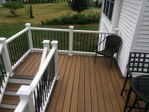 Transcend Havana Gold main decking, Spiced Rum border, pvc trimboard risers and fascia, Trex enhance rails with black pipe balusters