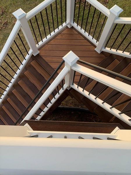 Trex Tiki Torch decking, Trex Lava Rock Border and Fascia,  Two tone stairs, White Trex Transcend Railing,  Waterford Michigan Oakland County Wright Way Contractors