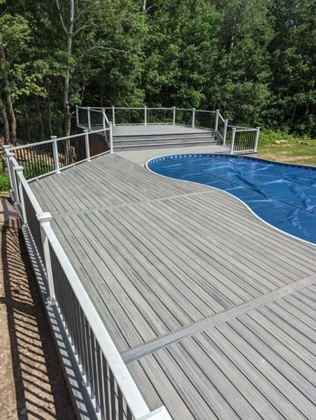 Trex Composite, Low- Maintenance Decking around a pool with aluminum railing built by RBM Construction, LLC. near Eau Claire, WI