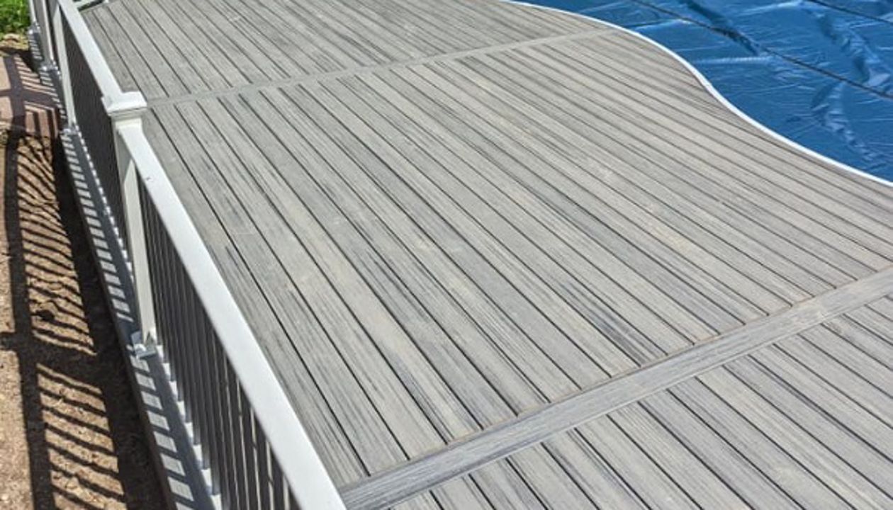 Trex Composite, Low- Maintenance Decking around a pool with aluminum railing built by RBM Construction, LLC. near Eau Claire, WI