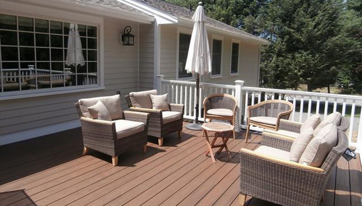 This new Trex Spiced Rum deck and white railing, created a whole new outdoor space that never existed before.
